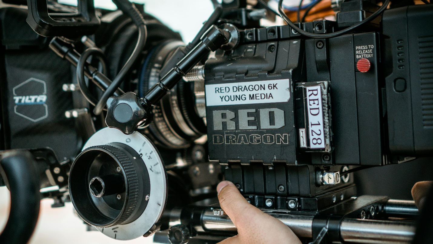 If the hiring process is successful, then newsrooms utilize a camera, such as this RED DRAGON 6K young media one pictured in a closeup.