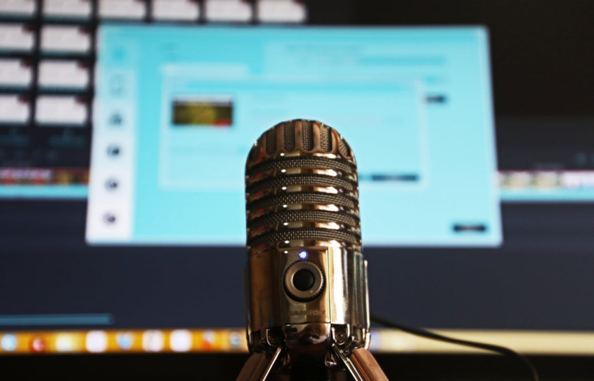 Selective focus photography of gray stainless steel condenser microphone