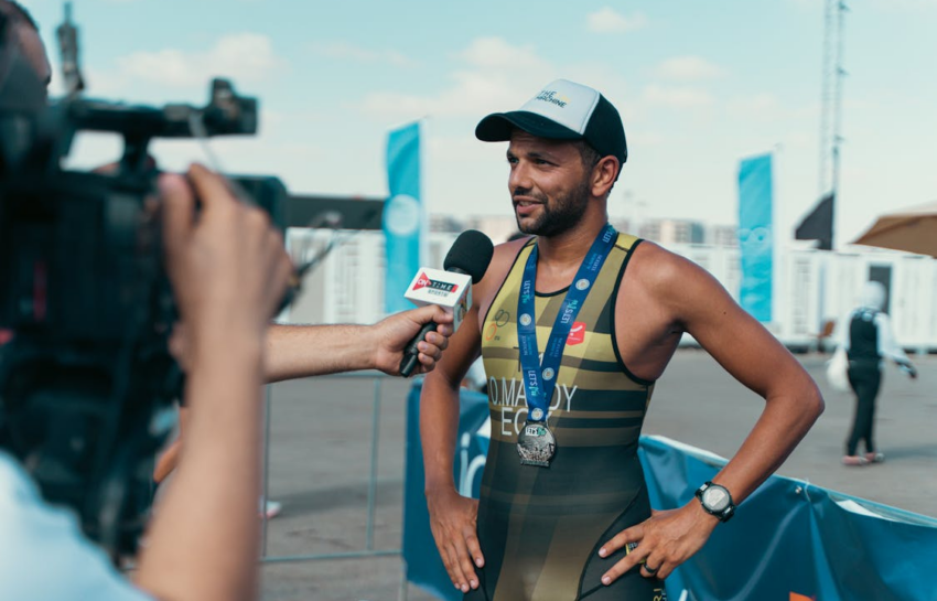 A journalist interviewing a runner
