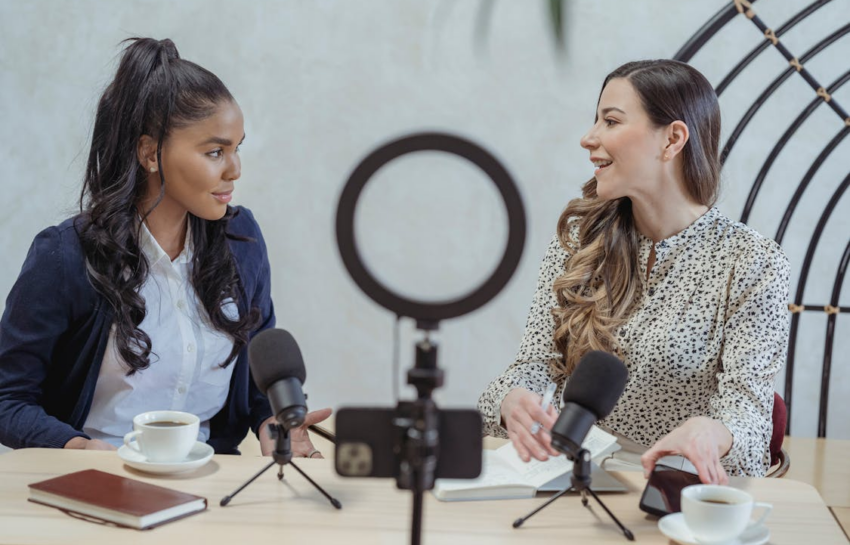 Two women talking as a mobile camera records them