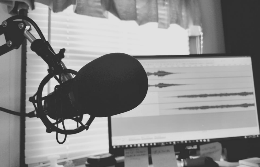 A microphone photographed in front of a screen